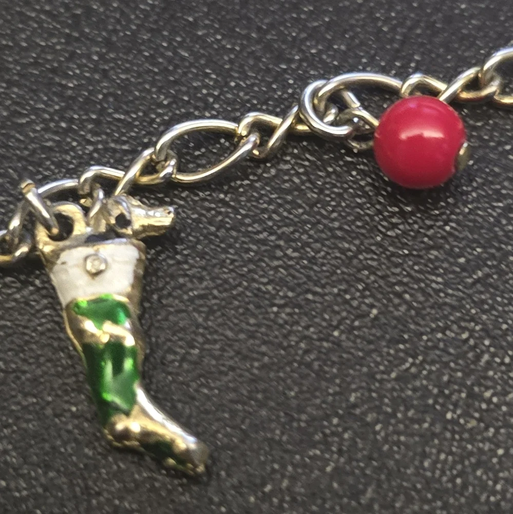 Festive Gold Charm Bracelet with Santa and Colorful Accents